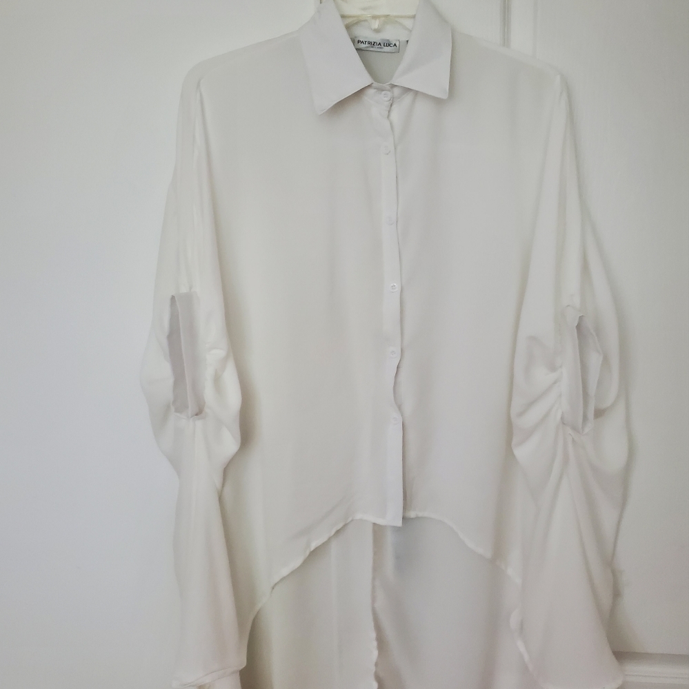 White flowy, high low shirt.